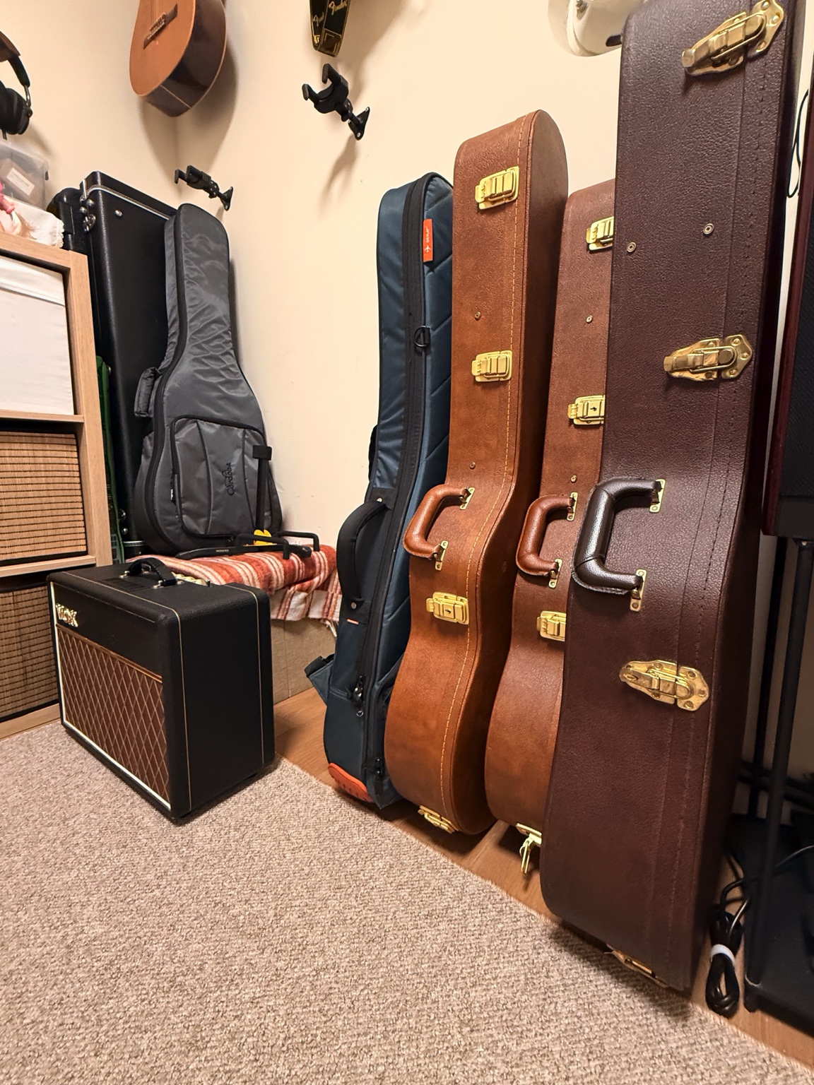 Guitar cases and a Vox amplifier in the music space